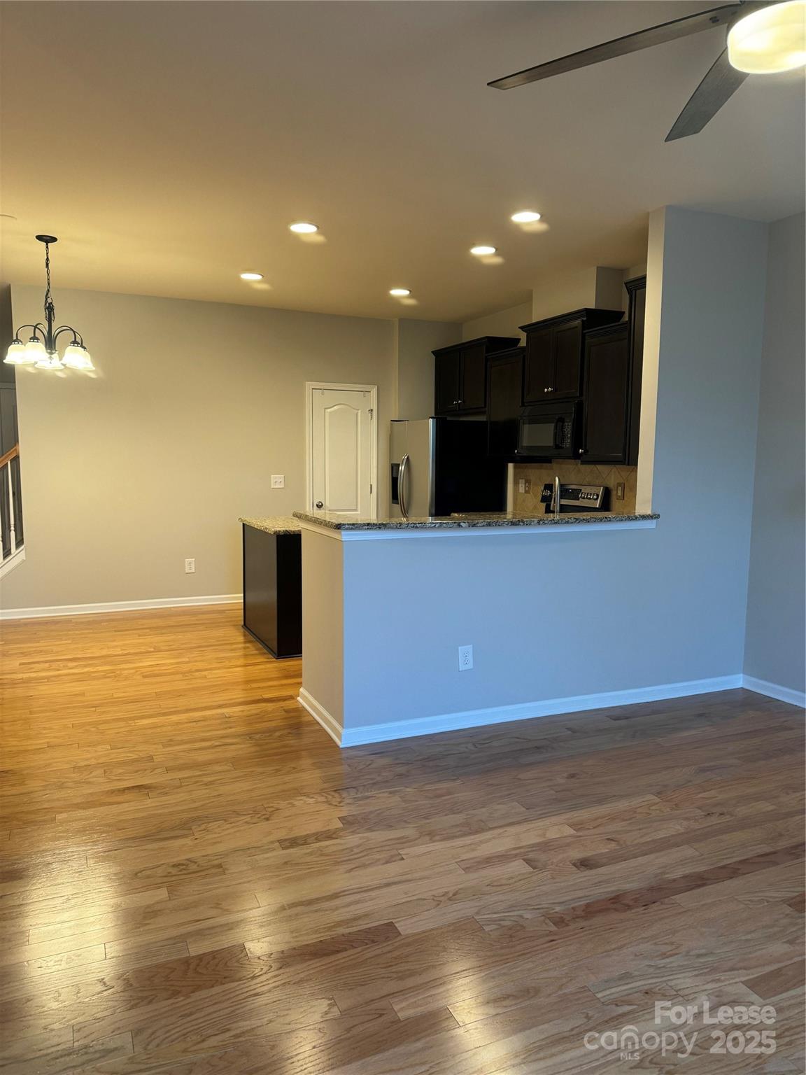 18431 The Commons Boulevard Cornelius, NC 28031 - Photo 5 of 24 a view of kitchen with wooden floor