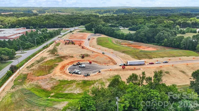 a view of a swimming pool with a yard