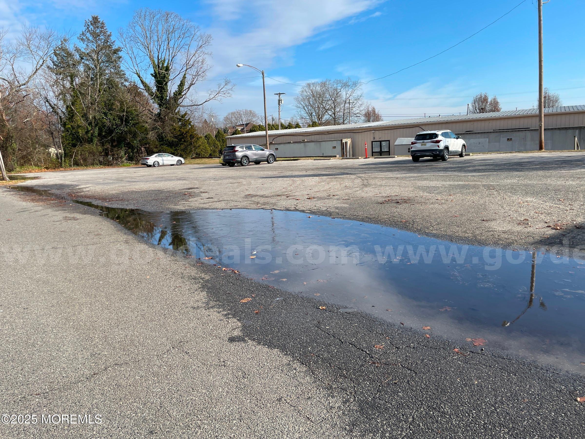 7 Gifford Road Little Egg Harbor, NJ 08087 - Photo 2 of 14 a view of a street with a car parked on the road