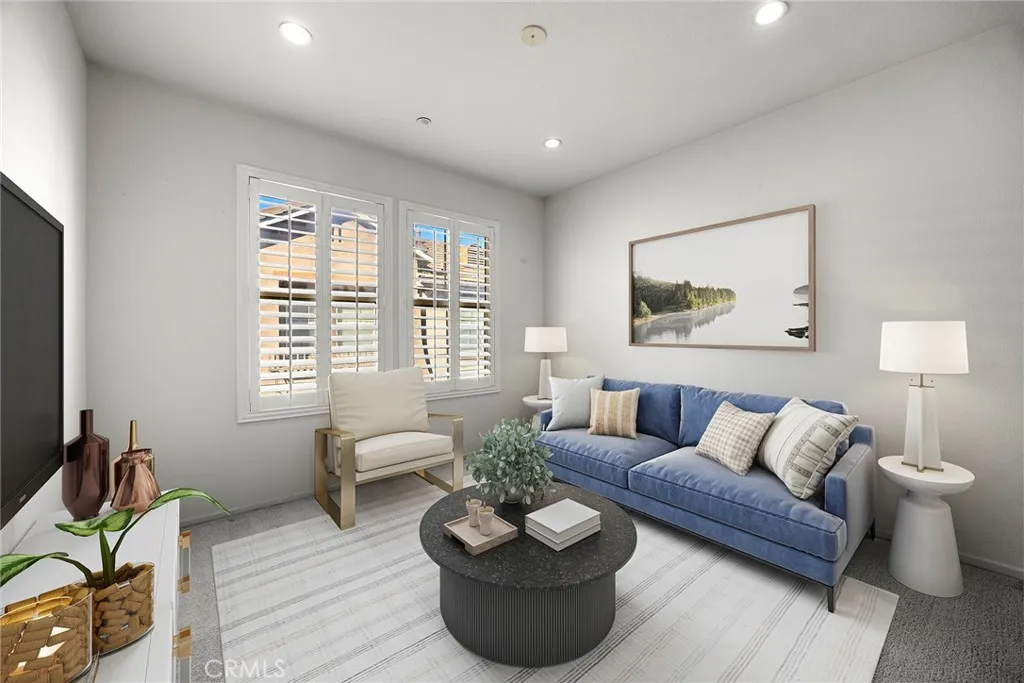 748 Ashby Lane, Unit 55 Brea, CA 92821 - Photo 15 of 41 a living room with furniture and a large window