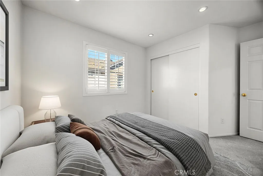 748 Ashby Lane, Unit 55 Brea, CA 92821 - Photo 23 of 41 a bedroom with a bed and a window