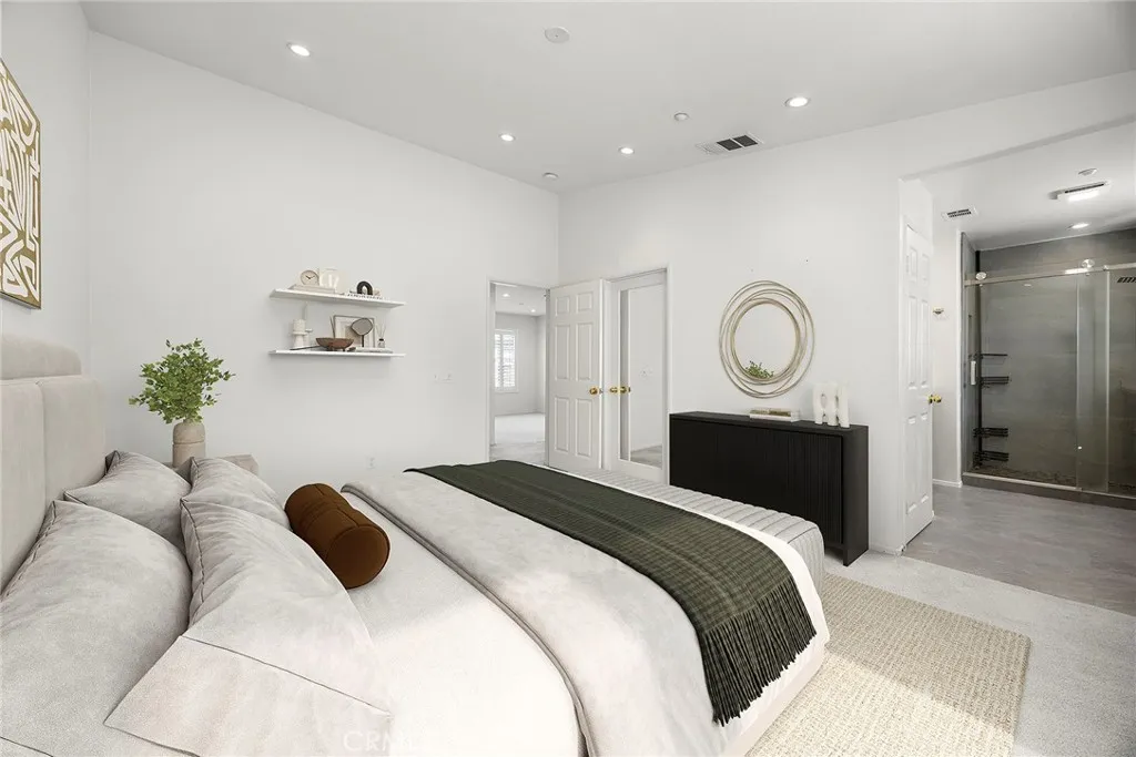 748 Ashby Lane, Unit 55 Brea, CA 92821 - Photo 31 of 41 a bedroom with a bed and a chandelier