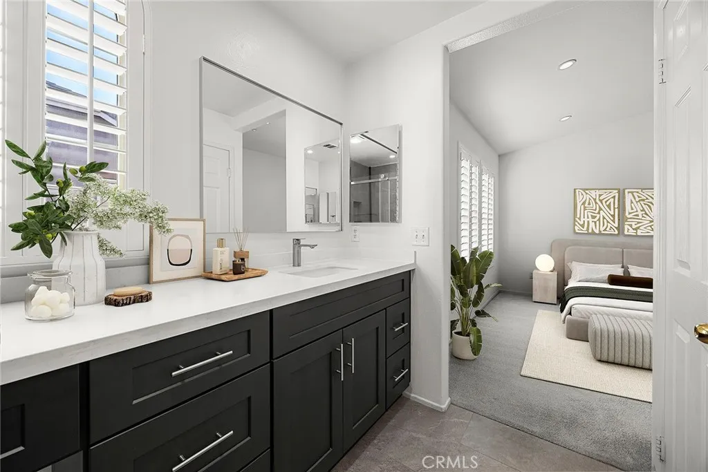 748 Ashby Lane, Unit 55 Brea, CA 92821 - Photo 35 of 41 a en suite bathroom with double sink and a mirror