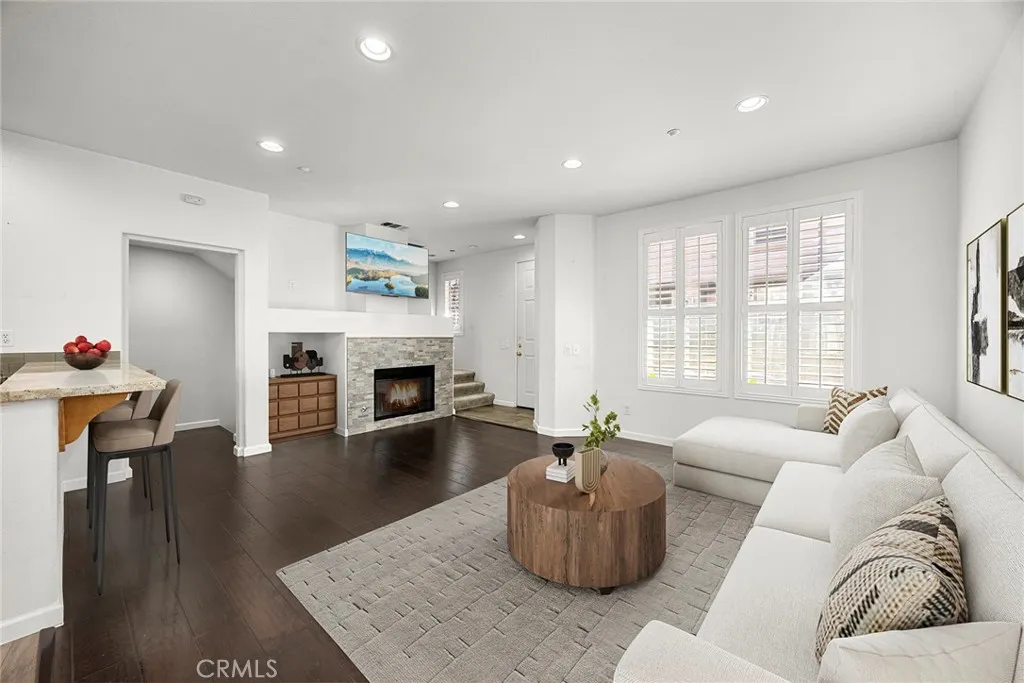 748 Ashby Lane, Unit 55 Brea, CA 92821 - Photo 6 of 41 a living room with furniture and a fireplace