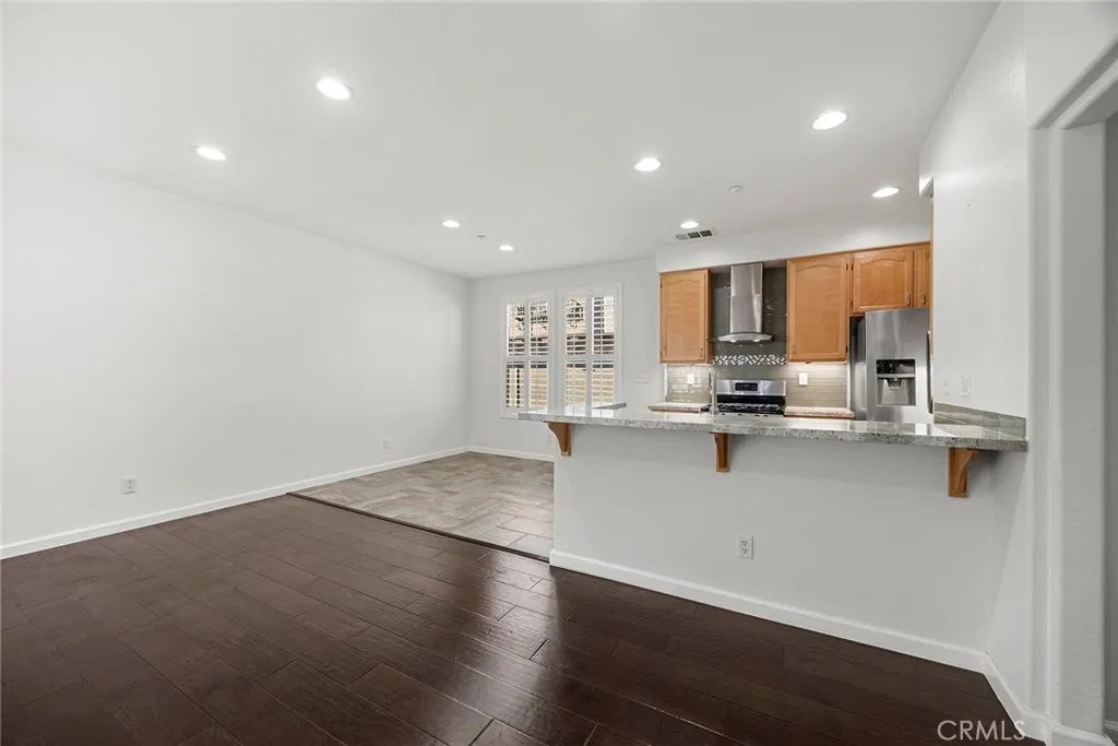 748 Ashby Lane, Unit 55 Brea, CA 92821 - Photo 9 of 41 a kitchen with stainless steel appliances a refrigerator sink and cabinets
