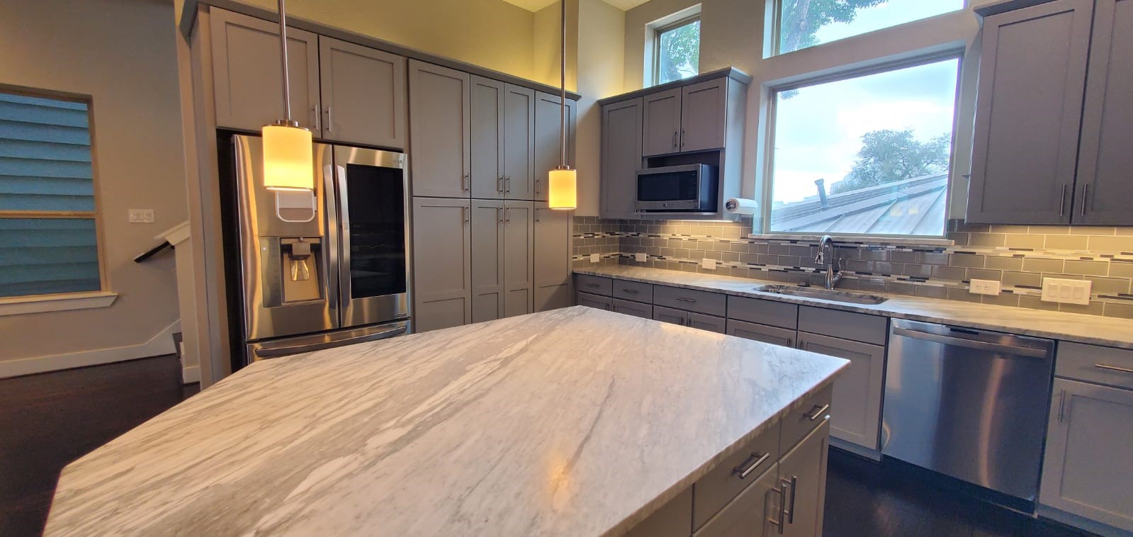 2422 Maufferd Street Houston, TX 77009 - Photo 12 of 35 a kitchen with stainless steel appliances granite countertop a sink a stove and a refrigerator