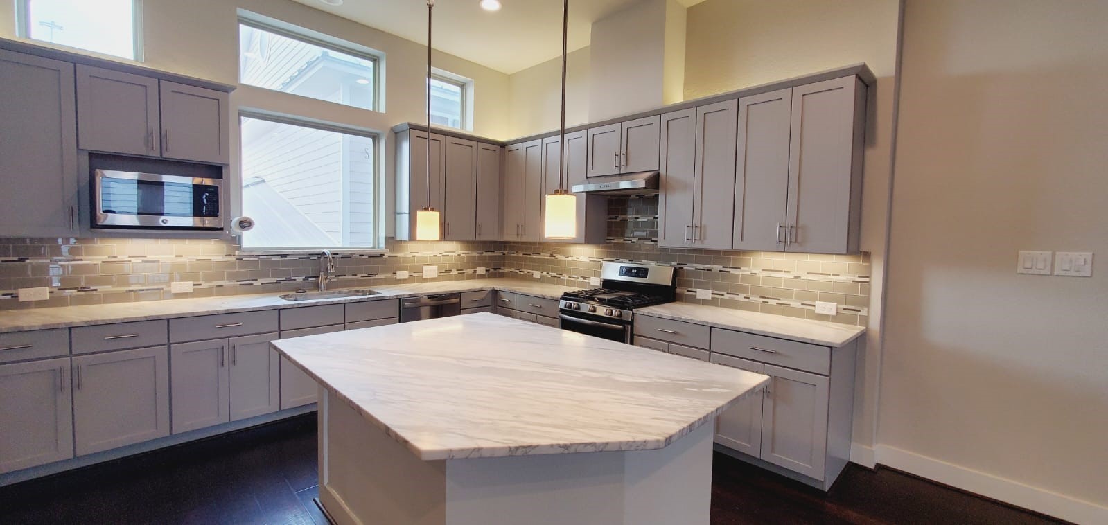 2422 Maufferd Street Houston, TX 77009 - Photo 18 of 35 a kitchen with stainless steel appliances granite countertop a sink stove and refrigerator