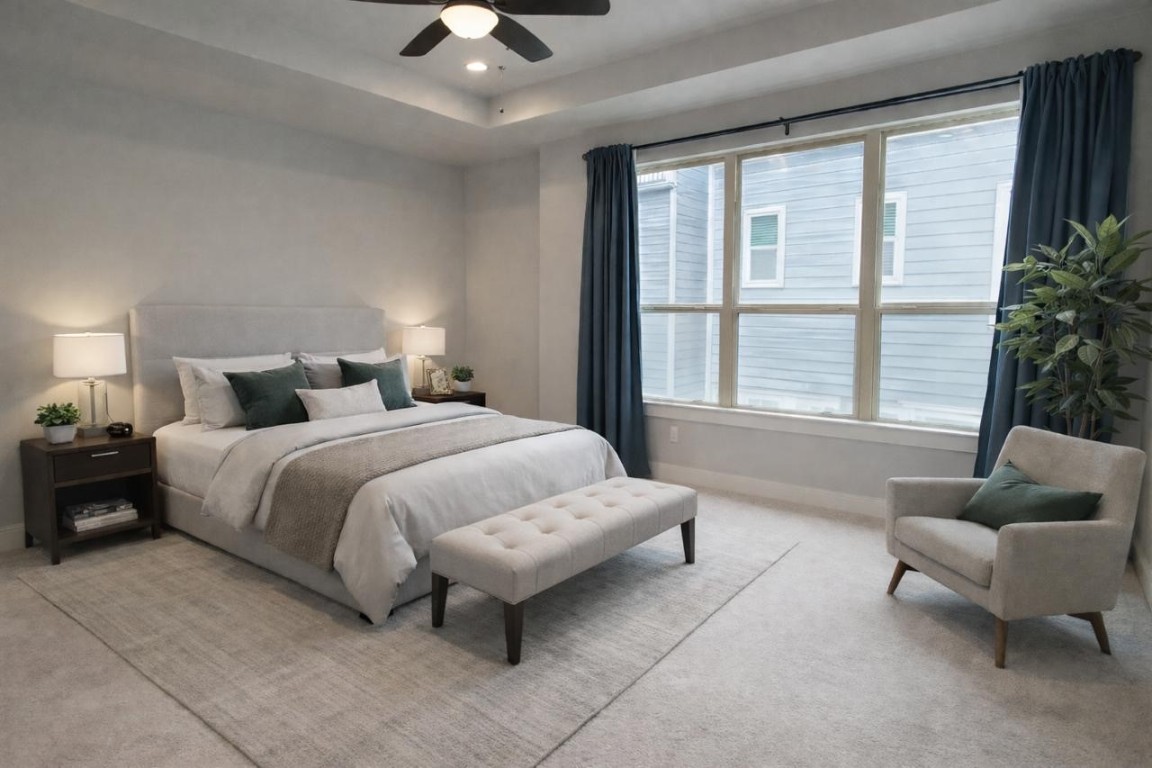 2422 Maufferd Street Houston, TX 77009 - Photo 19 of 35 a bedroom with a large bed couch and a large window
