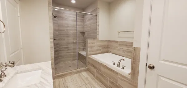 an empty room with ceiling fan and window