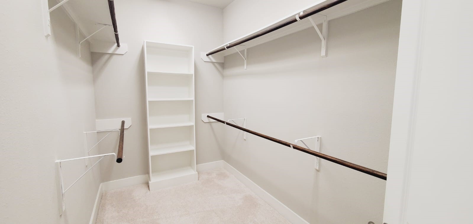 2422 Maufferd Street Houston, TX 77009 - Photo 24 of 35 a view of walk in closet with empty racks