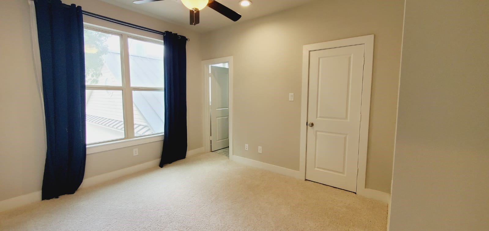 2422 Maufferd Street Houston, TX 77009 - Photo 25 of 35 an empty room with ceiling fan and window