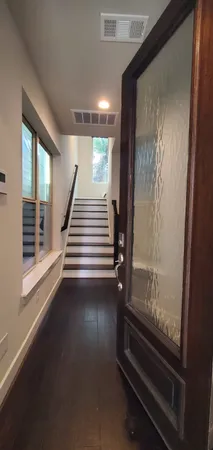 a view of room with window and stairs