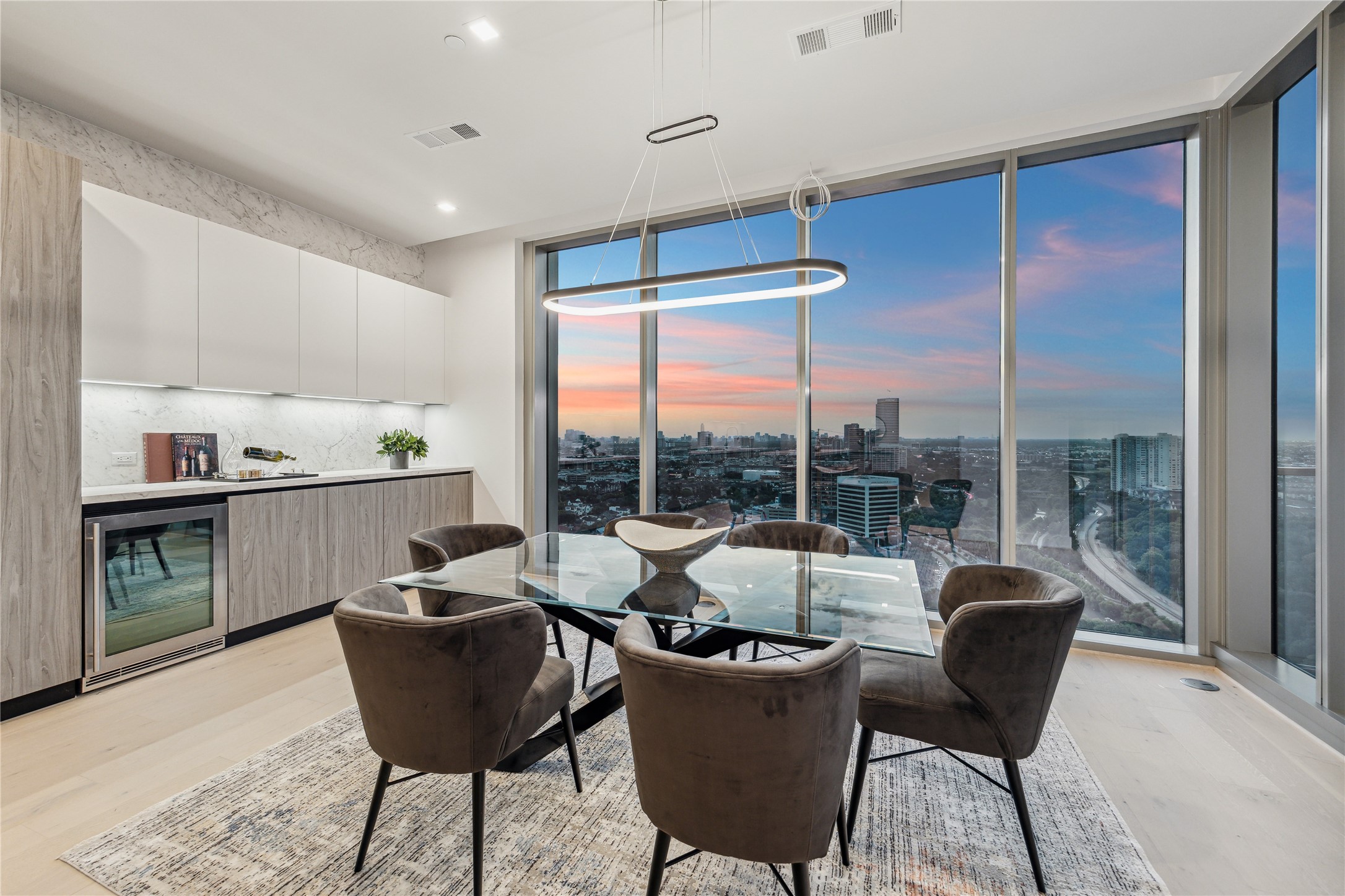 1711 Allen Parkway, Unit 2301 Houston, TX 77019 - Photo 13 of 45 a view of a dining room with furniture window and outside view