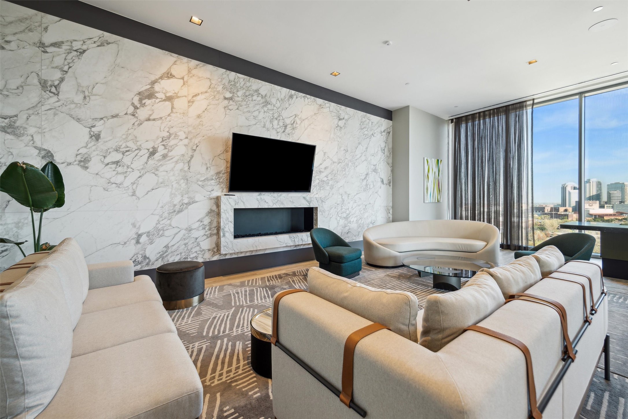 1711 Allen Parkway, Unit 2301 Houston, TX 77019 - Photo 37 of 45 a living room with furniture and a flat screen tv