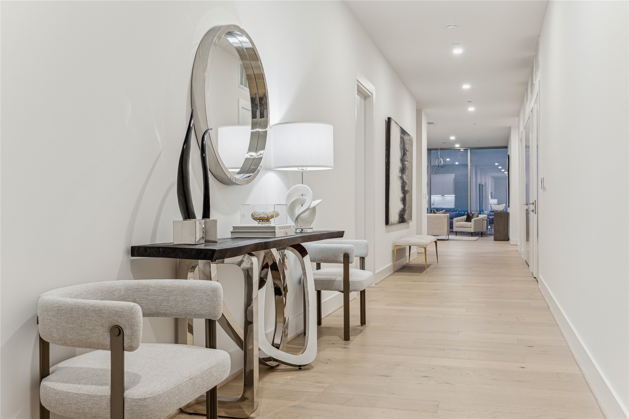 1711 Allen Parkway, Unit 2301 Houston, TX 77019 - Photo 5 of 45 a dining room with furniture and a mirror