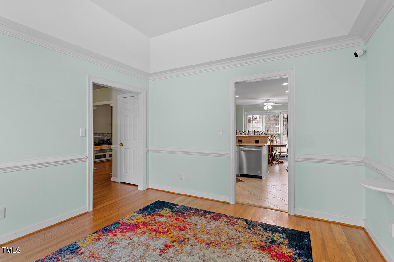 7917 Fairlake Drive Wake Forest, NC 27587 - Photo 14 of 34 a room with wooden floor and a rug