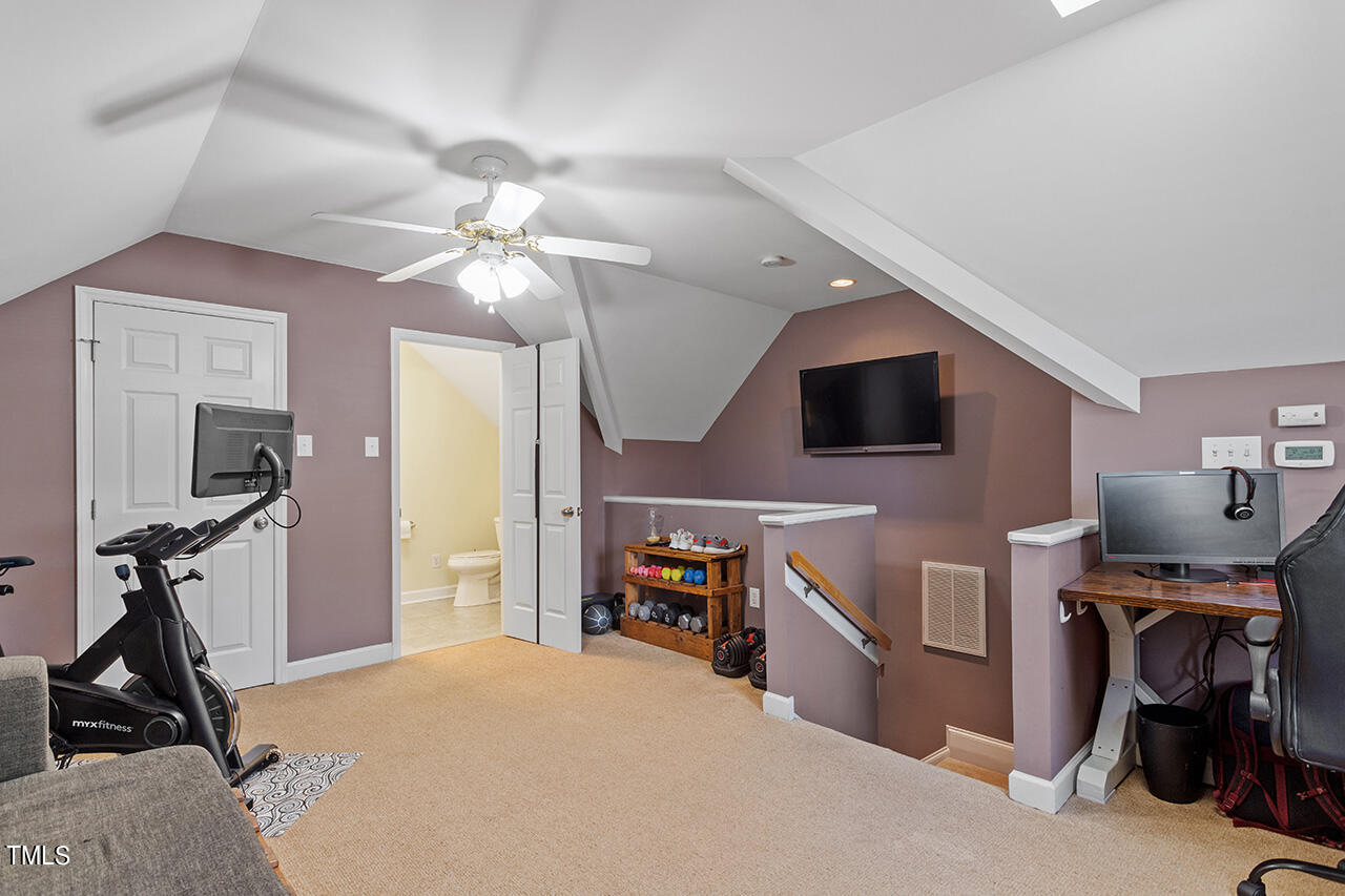 7917 Fairlake Drive Wake Forest, NC 27587 - Photo 33 of 34 a living room with furniture and a flat screen tv