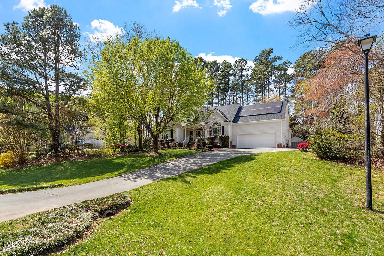 7917 Fairlake Drive Wake Forest, NC 27587 - Photo 4 of 34 a house with swimming pool in front of it