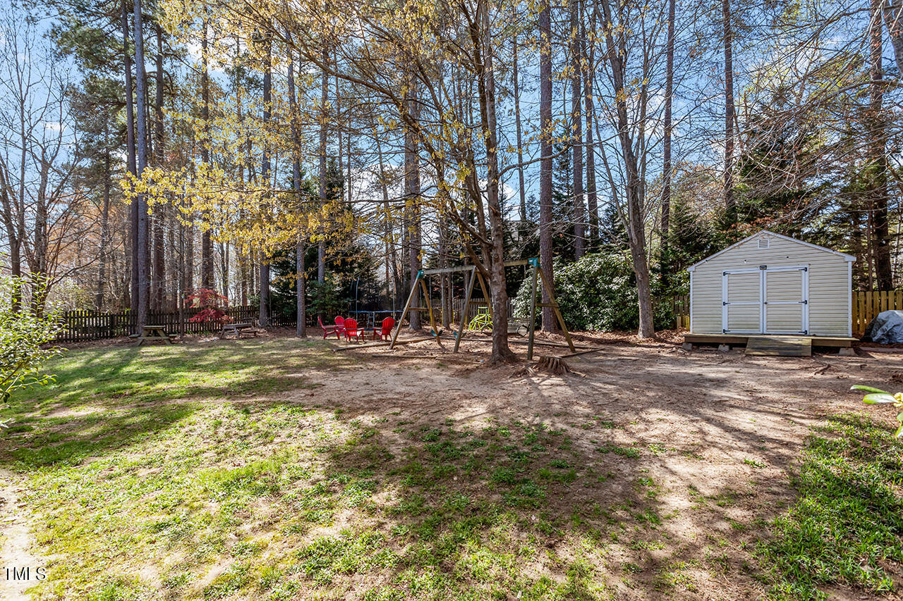 7917 Fairlake Drive Wake Forest, NC 27587 - Photo 5 of 34 a view of yard with green space