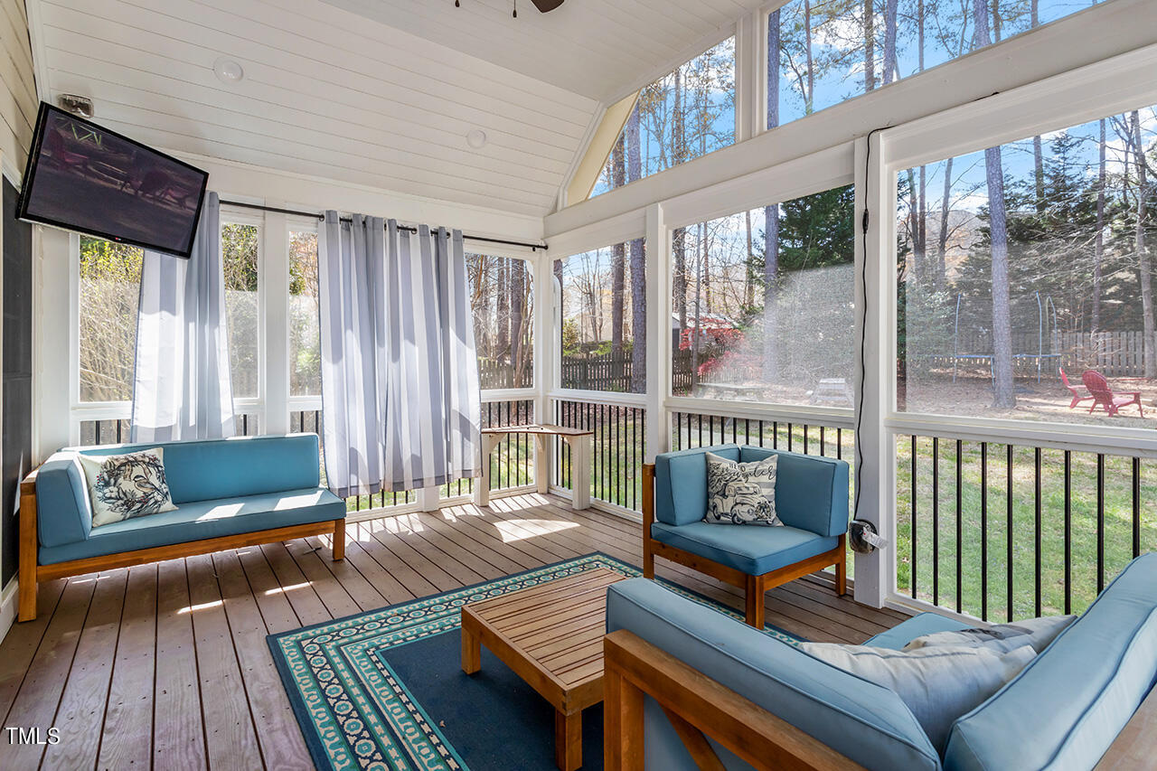 7917 Fairlake Drive Wake Forest, NC 27587 - Photo 8 of 34 a living room with furniture and a floor to ceiling window