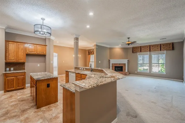 a open kitchen with cabinets stove and oven
