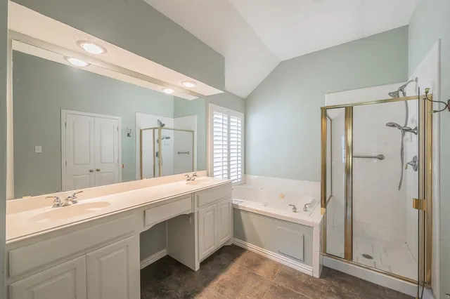 a bathroom with a double vanity sink mirror double and bathtub
