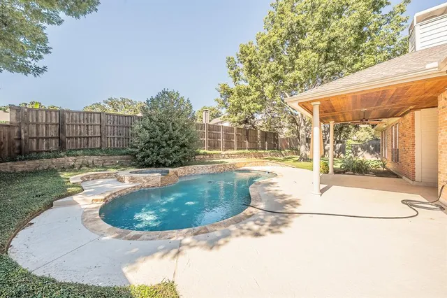 a view of a house with pool yard and furniture