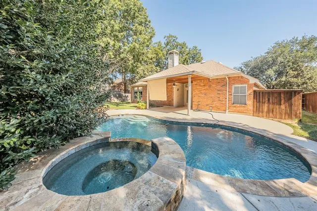 a view of a swimming pool with a sitting area