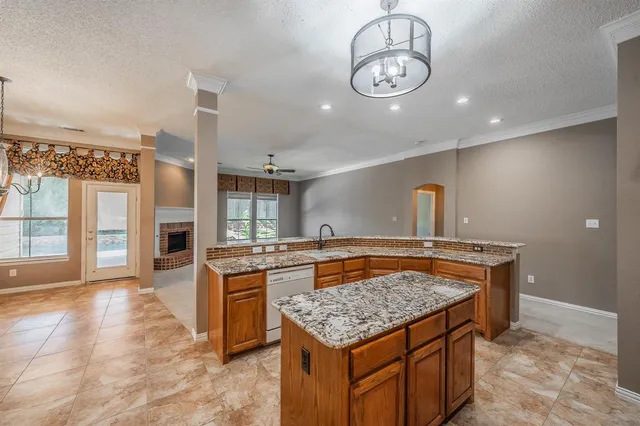 a kitchen that has a lot of cabinets in it