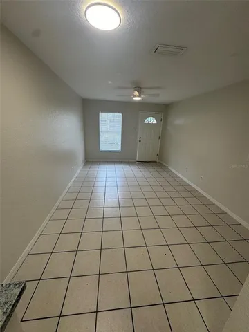 a view of an empty room and window