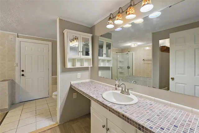 a bathroom with a sink double vanity and a mirror