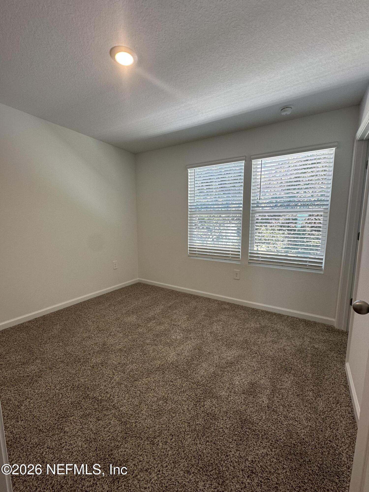 141 Palmetto Rdg Road St. Augustine, FL 32095 - Photo 22 of 43 an empty room with windows