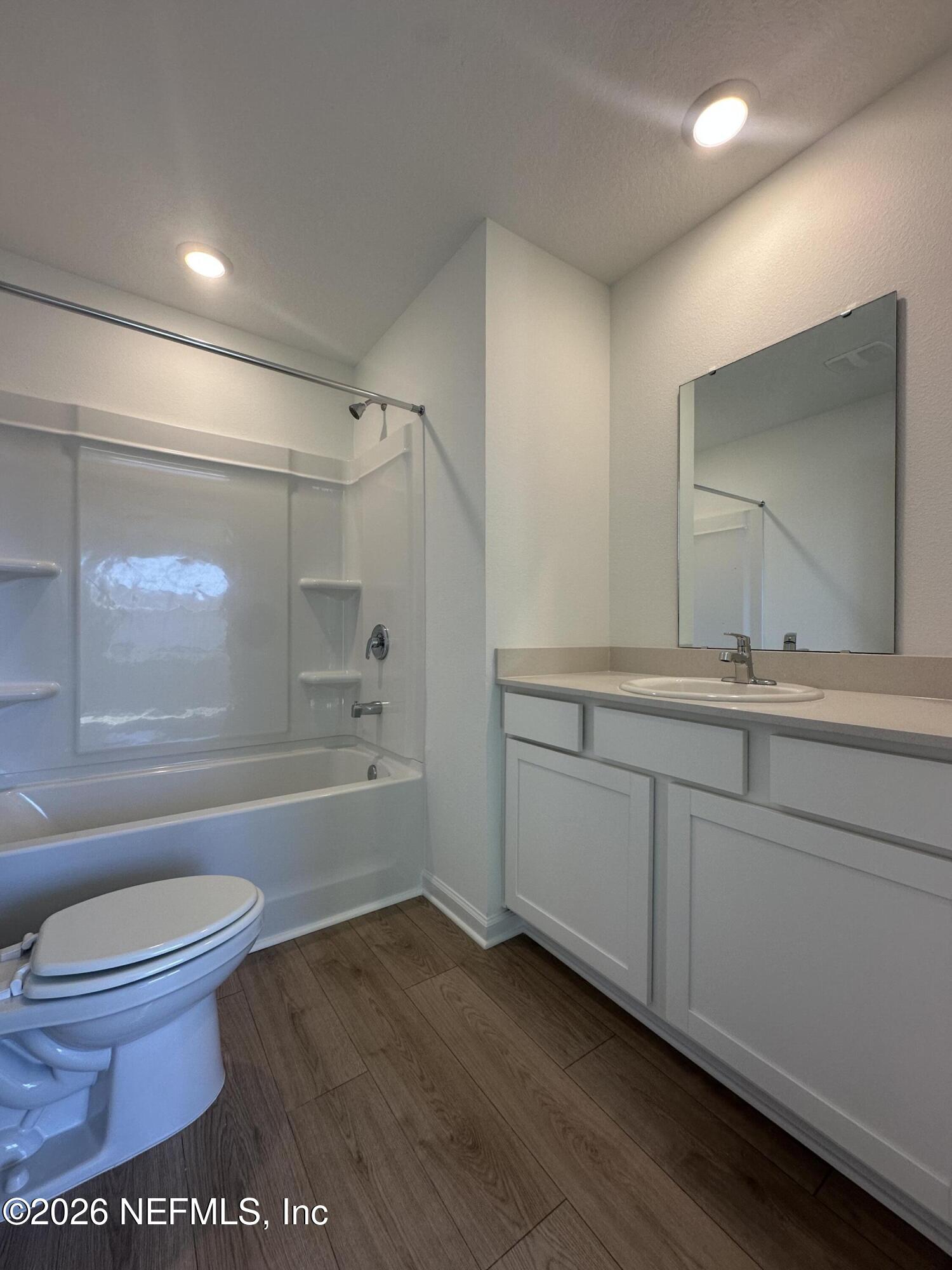 141 Palmetto Rdg Road St. Augustine, FL 32095 - Photo 30 of 43 a bathroom with a bathtub toilet mirror shower vanity and a sink