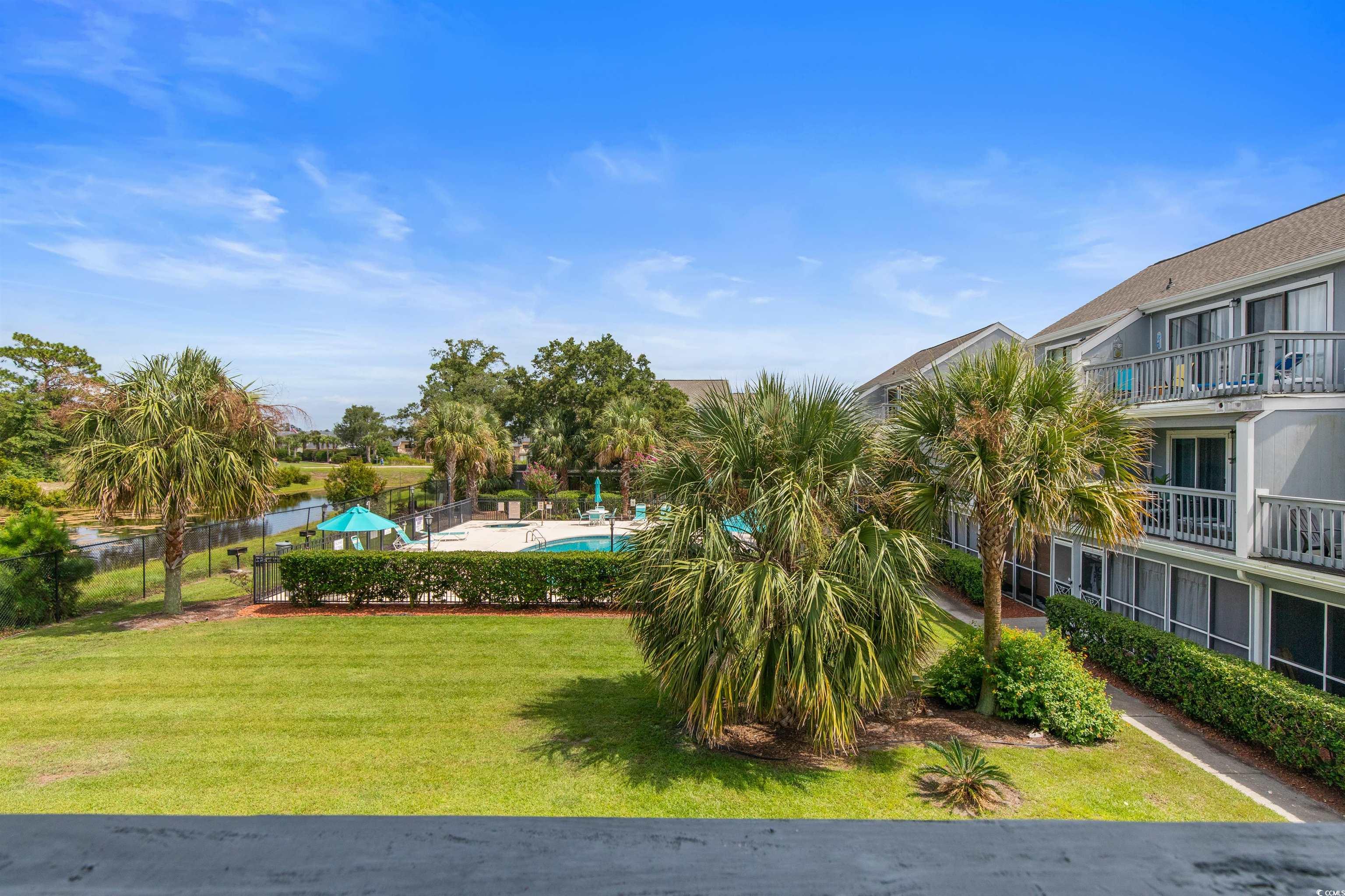 1850 Colony Drive, Unit 3D Surfside Beach, SC 29575 - Photo 26 of 38 Surrounding community with a swimming pool and a balcony