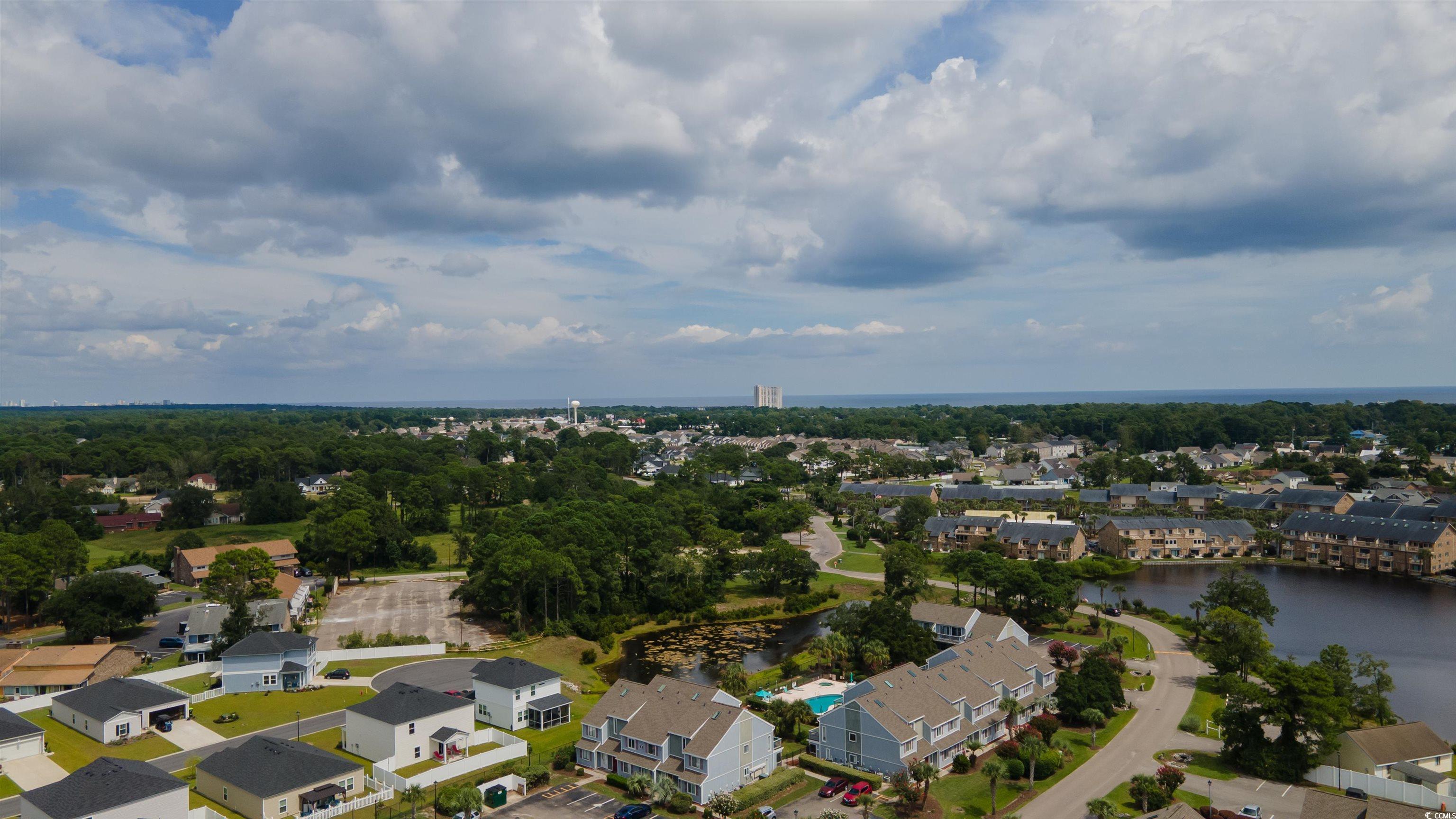 1850 Colony Drive, Unit 3D Surfside Beach, SC 29575 - Photo 28 of 38 Aerial perspective of suburban area featuring a large body of water