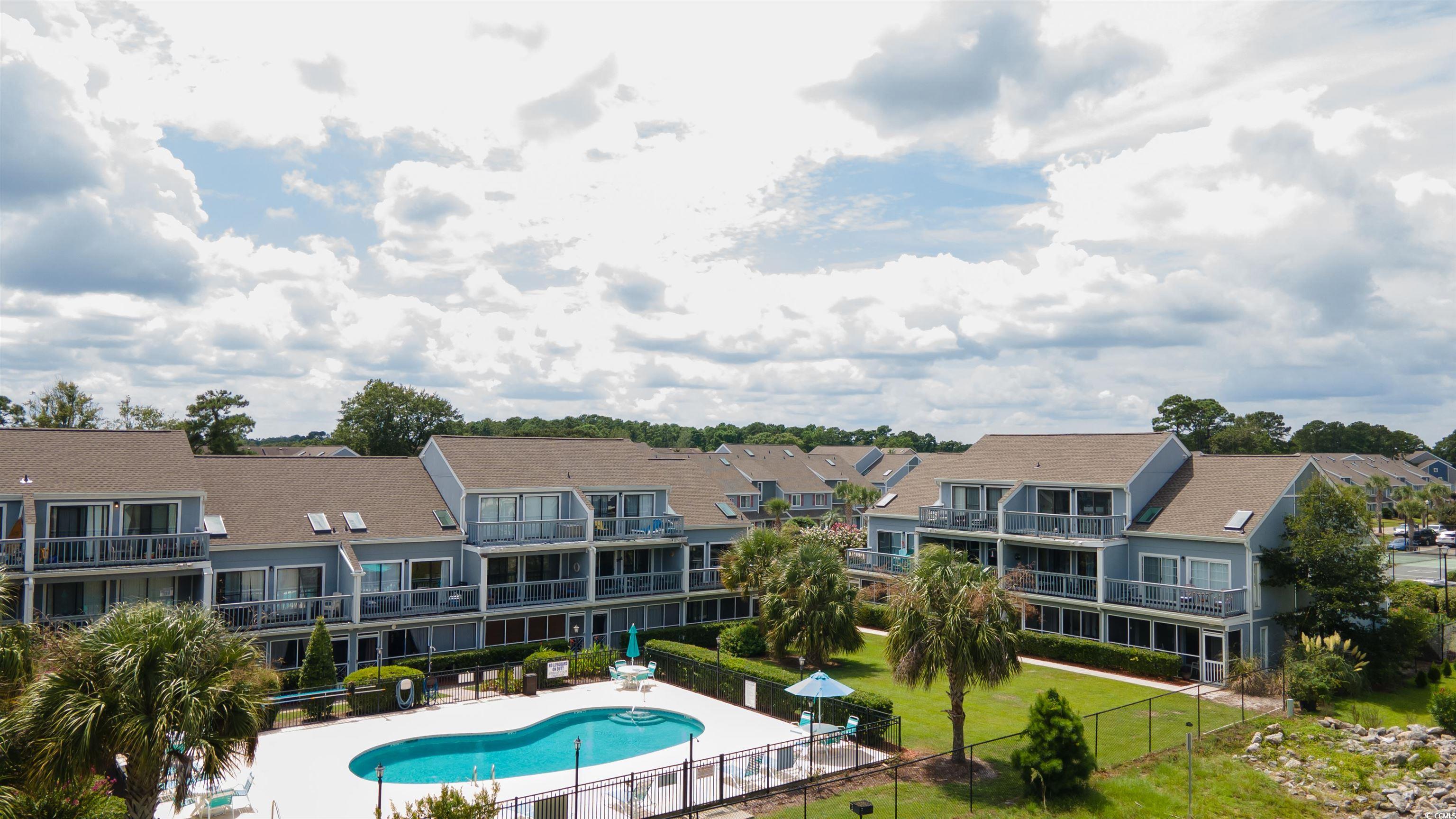 1850 Colony Drive, Unit 3D Surfside Beach, SC 29575 - Photo 35 of 38 Community pool featuring a patio and a residential view