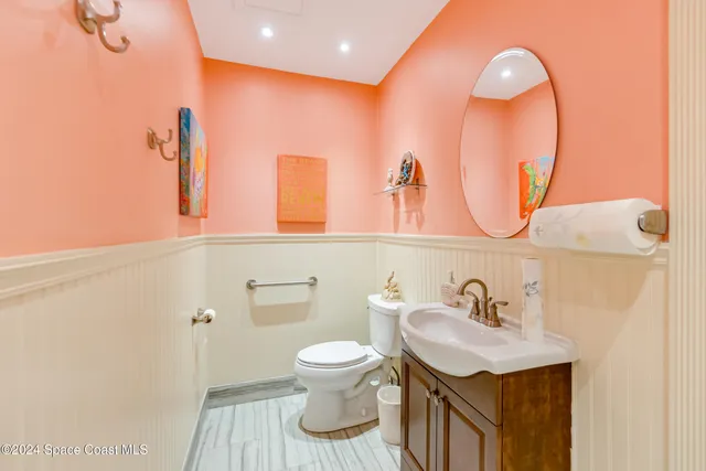 a kitchen with a table chairs refrigerator and microwave