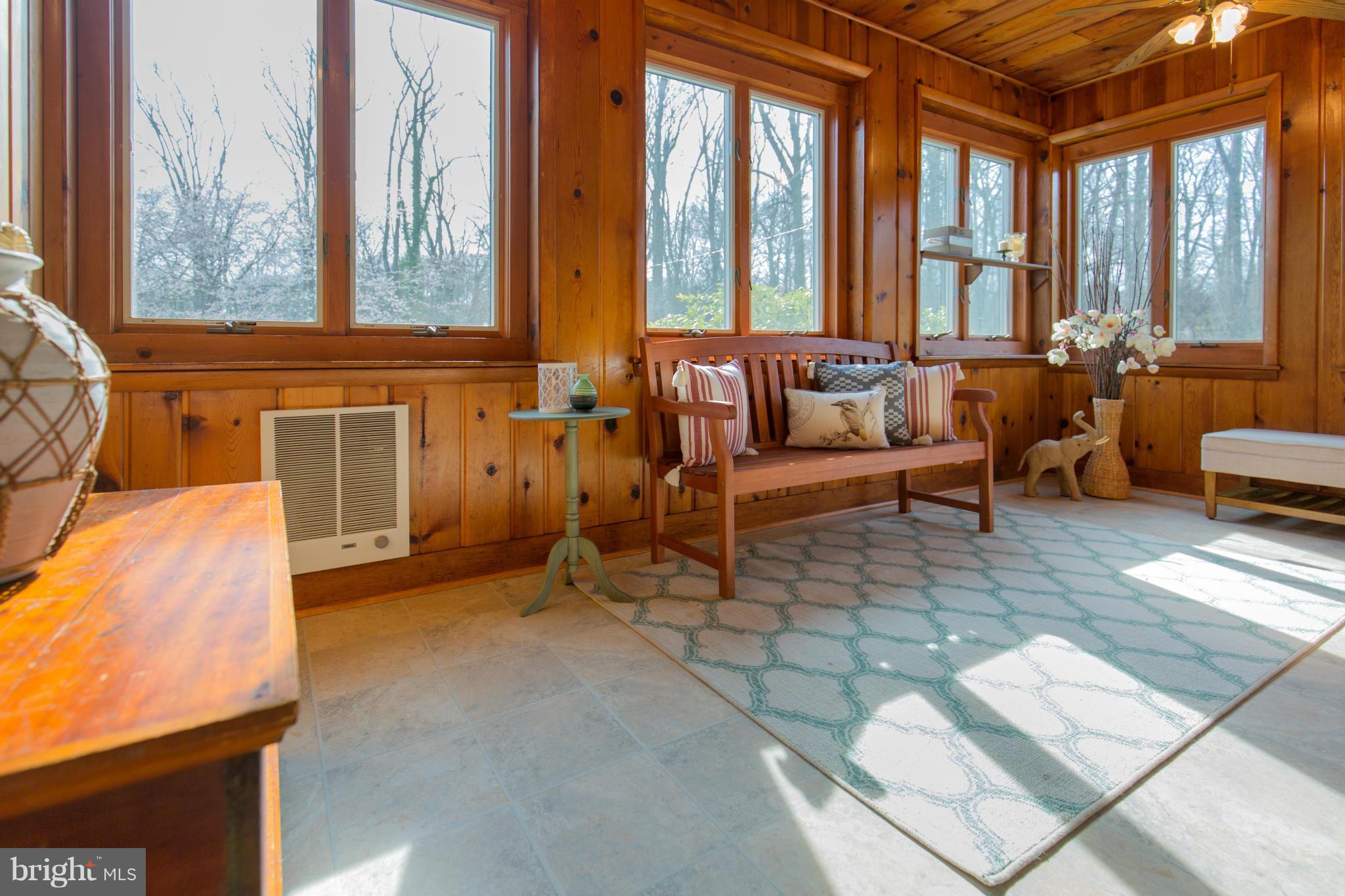 9601 Lorain Avenue Silver Spring, MD 20901 - Photo 12 of 30 a living room with furniture and large windows