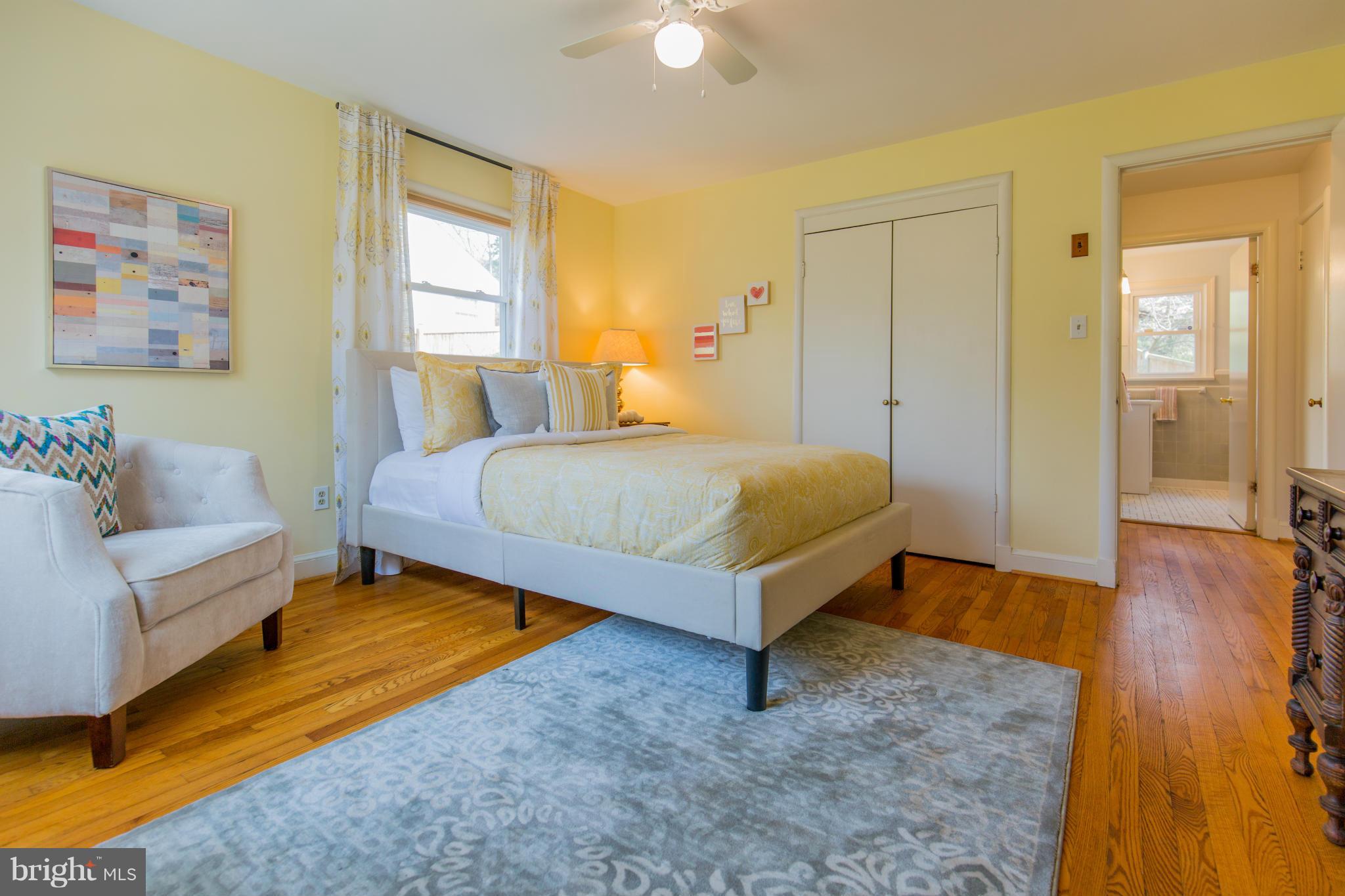 9601 Lorain Avenue Silver Spring, MD 20901 - Photo 14 of 30 a bedroom with a bed and a couch