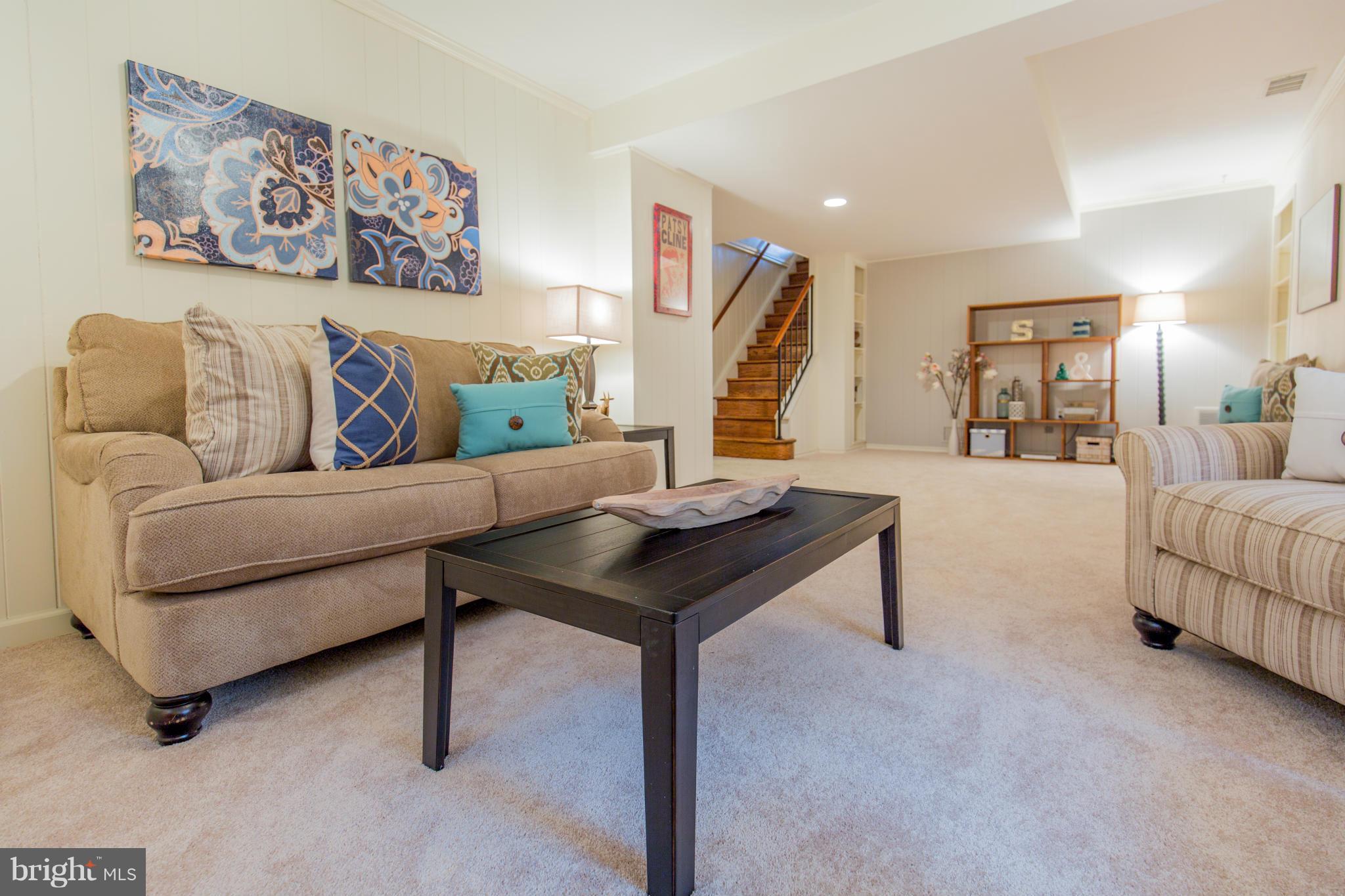 9601 Lorain Avenue Silver Spring, MD 20901 - Photo 23 of 30 a living room with furniture and a wooden floor