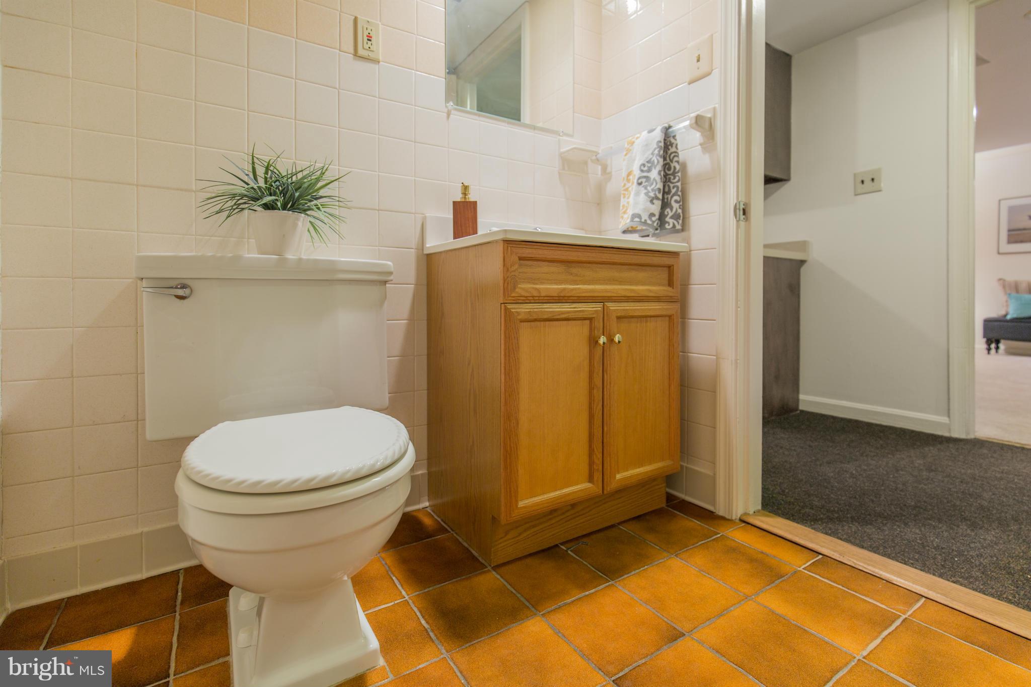 9601 Lorain Avenue Silver Spring, MD 20901 - Photo 29 of 30 a bathroom with a sink and a toilet