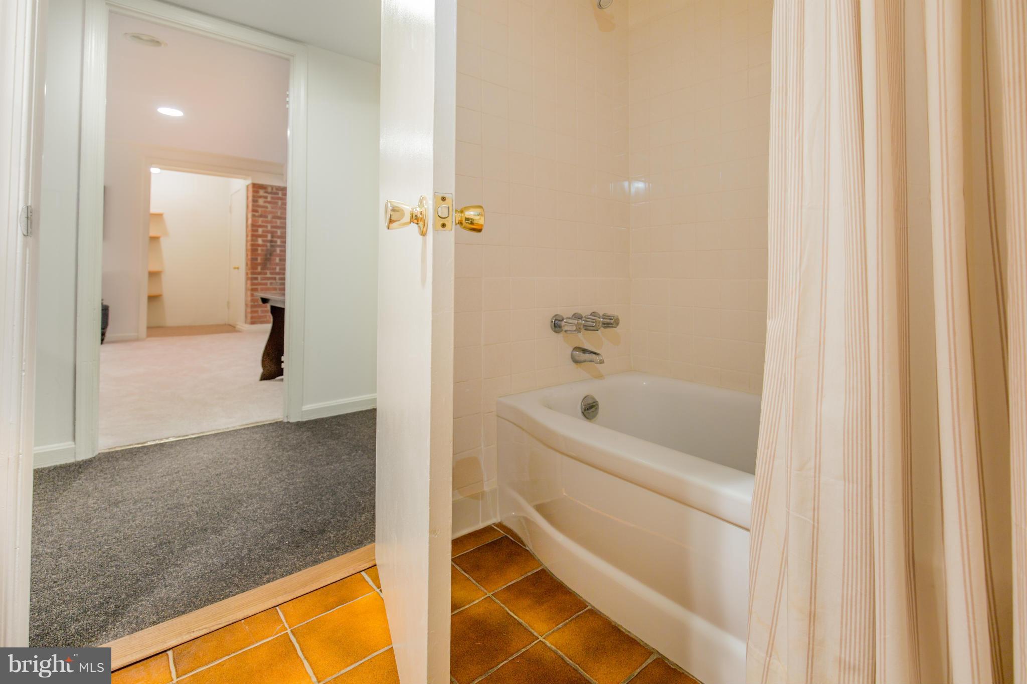 9601 Lorain Avenue Silver Spring, MD 20901 - Photo 30 of 30 a bathroom with a bathtub