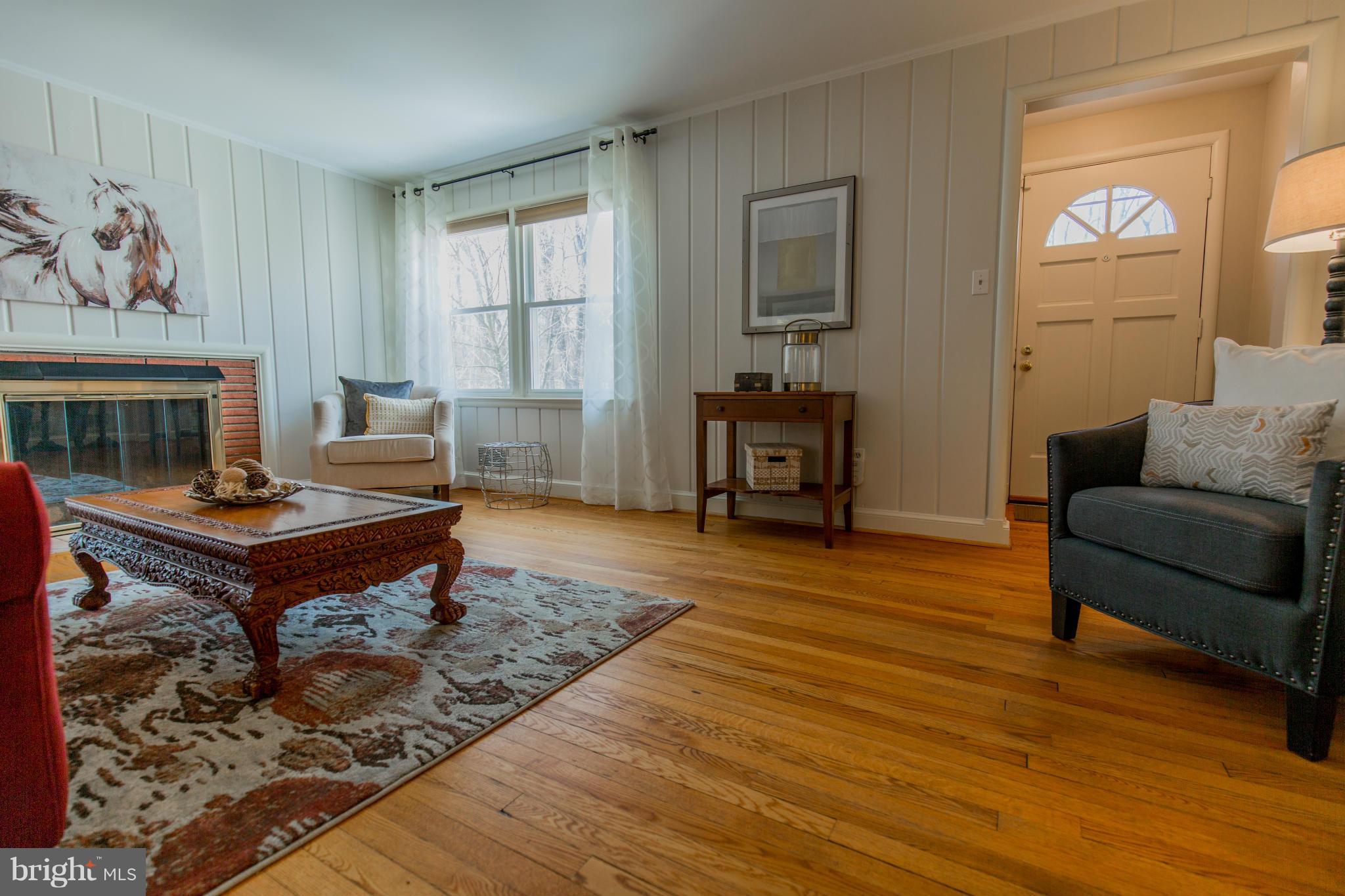 9601 Lorain Avenue Silver Spring, MD 20901 - Photo 6 of 30 a living room with furniture a rug and a window