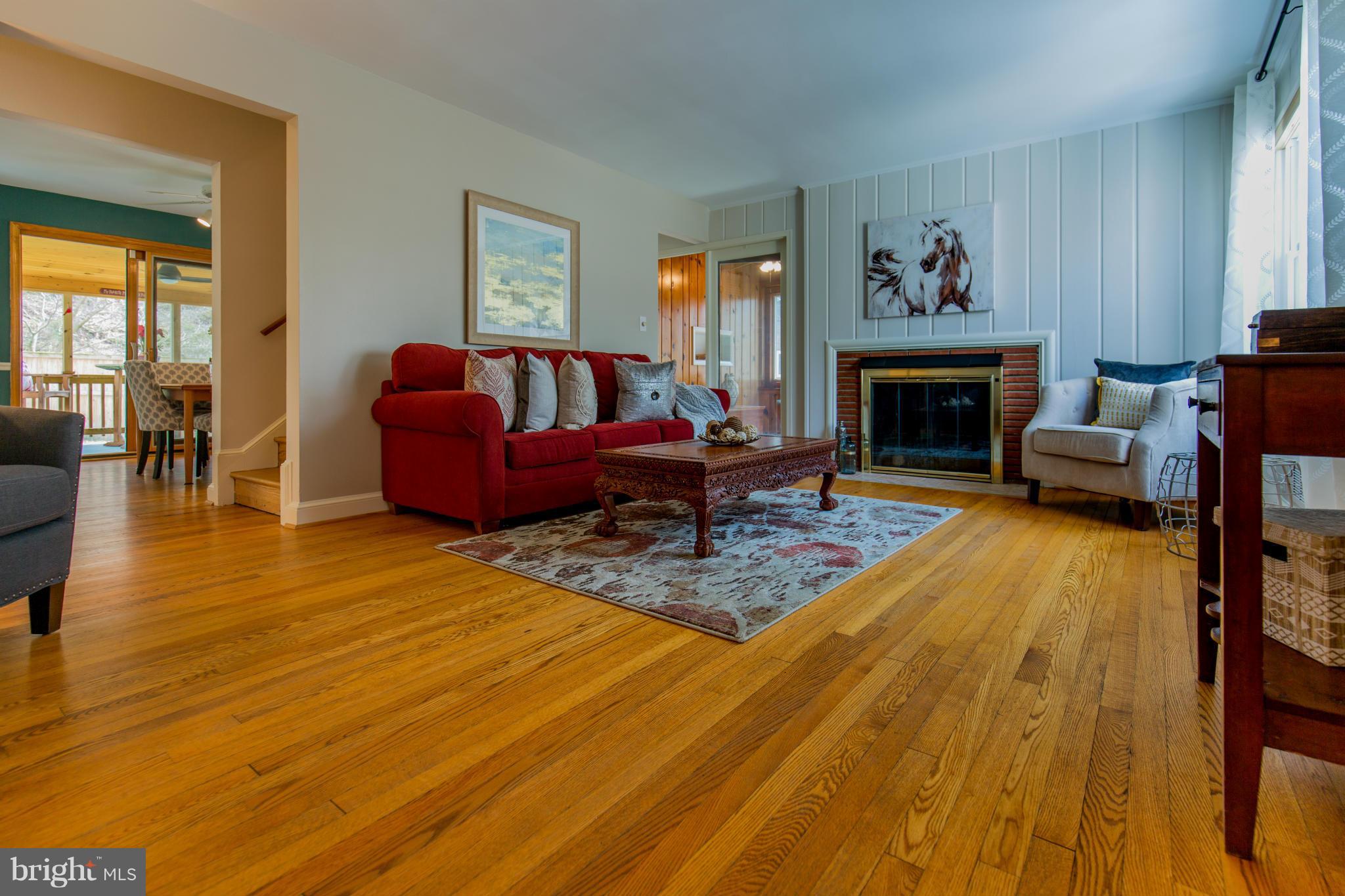 9601 Lorain Avenue Silver Spring, MD 20901 - Photo 7 of 30 a living room with furniture and a fireplace