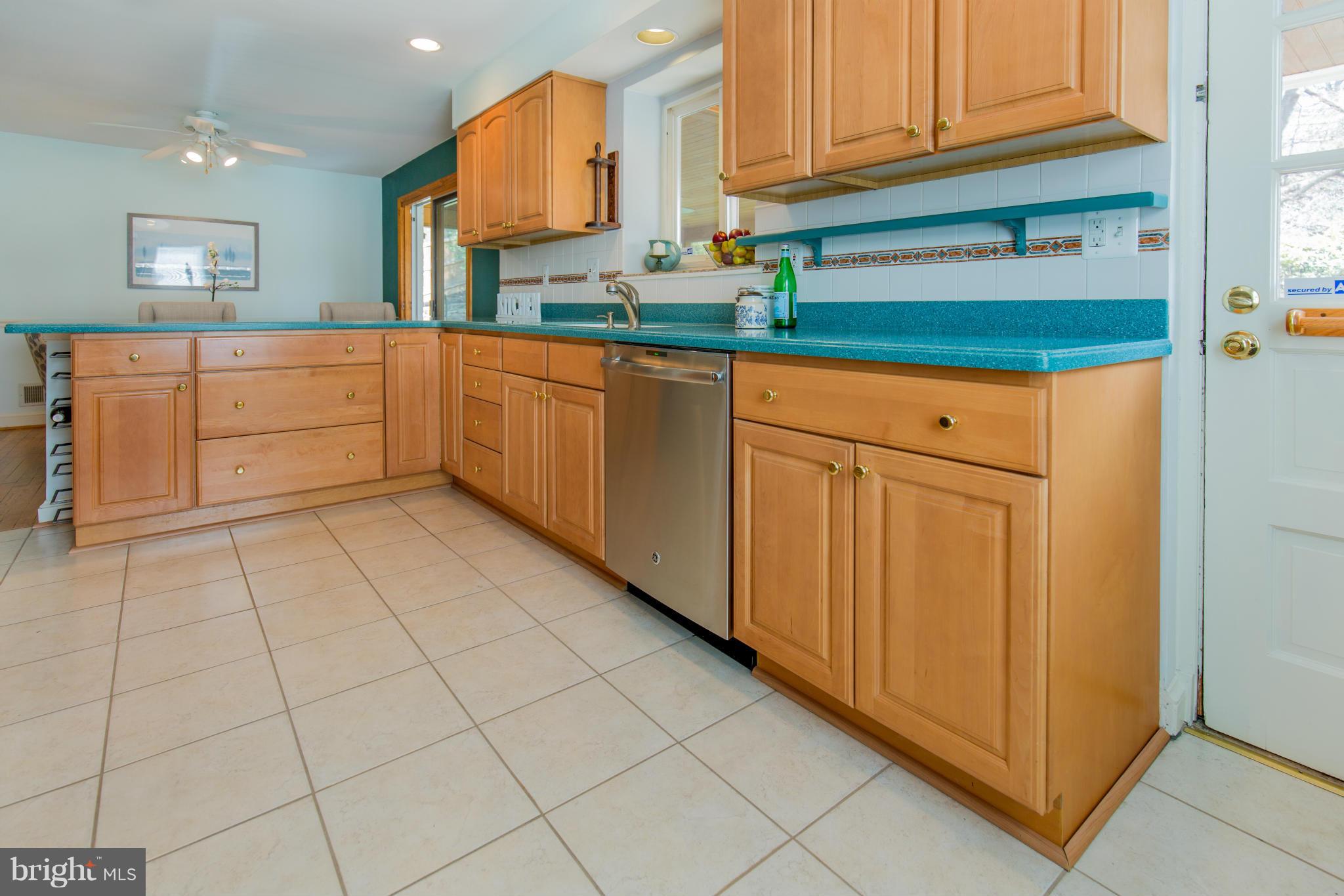 9601 Lorain Avenue Silver Spring, MD 20901 - Photo 10 of 30 a kitchen with stainless steel appliances granite countertop a sink and cabinets