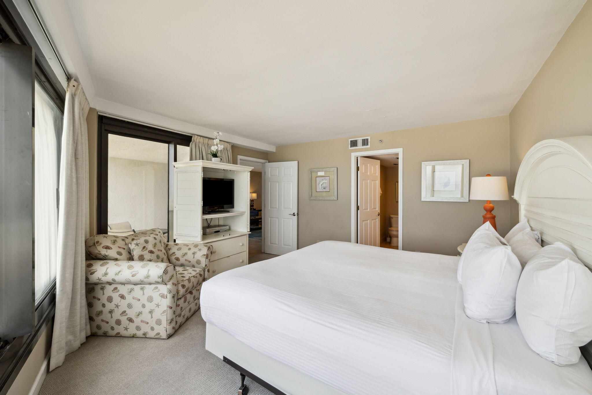 4072 Beachside 1, Unit 4072 Miramar Beach, FL 32550 - Photo 19 of 75 a bedroom with a large bed and a flat tv screen