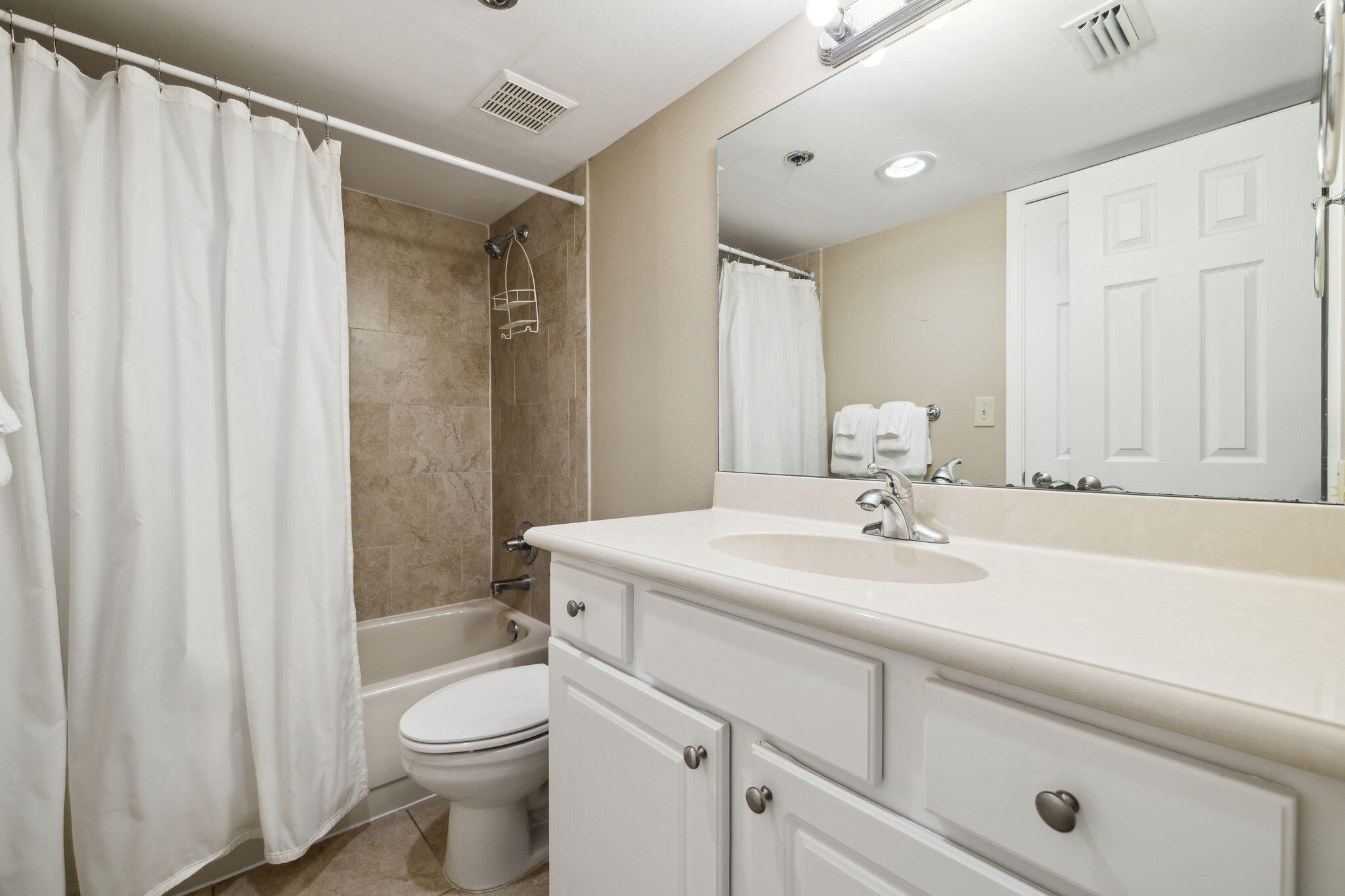 4072 Beachside 1, Unit 4072 Miramar Beach, FL 32550 - Photo 24 of 75 a bathroom with a sink a toilet and shower