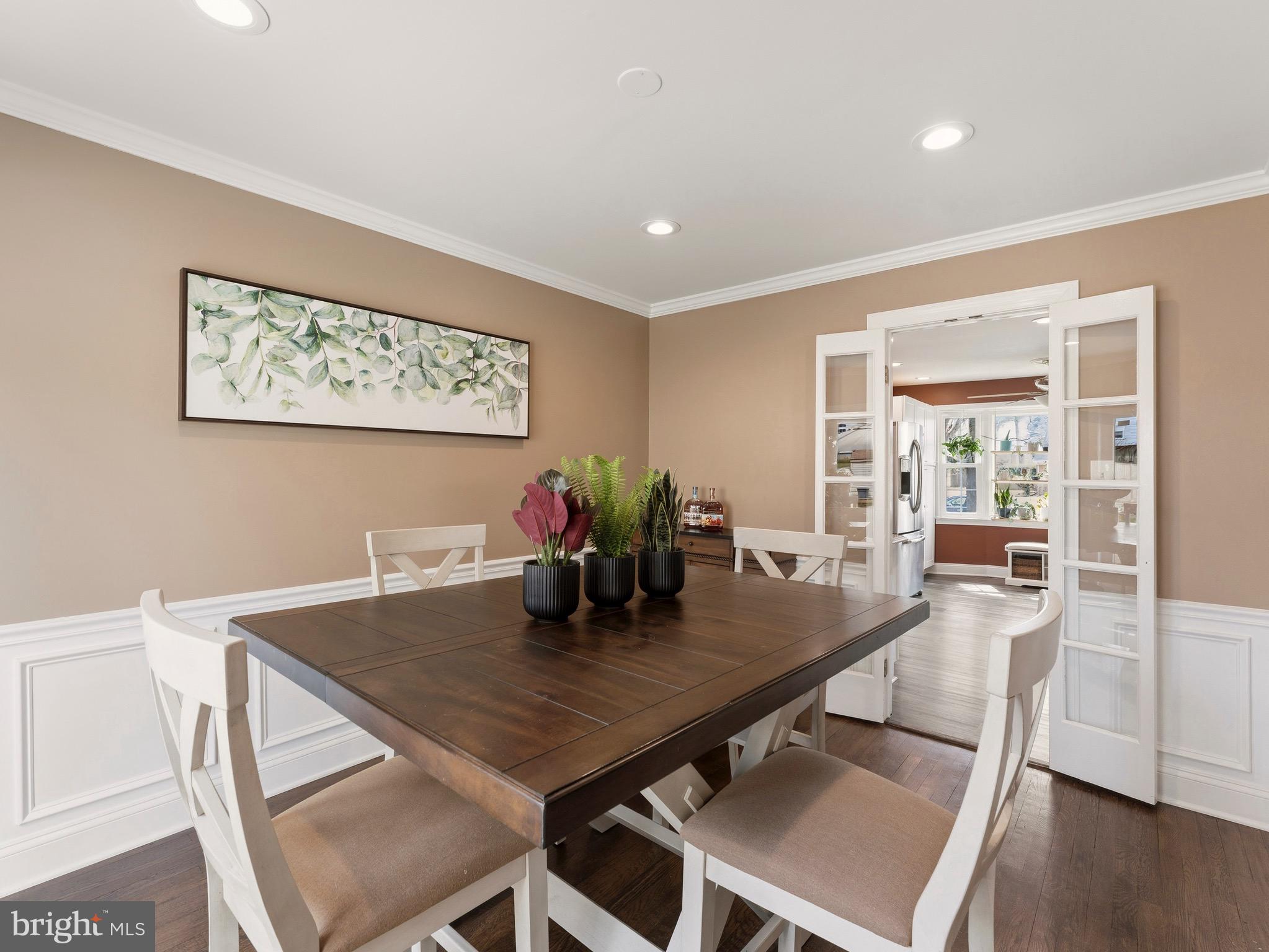 13744 Lockdale Road Silver Spring, MD 20906 - Photo 11 of 37 a view of a dining room with furniture and wooden floor