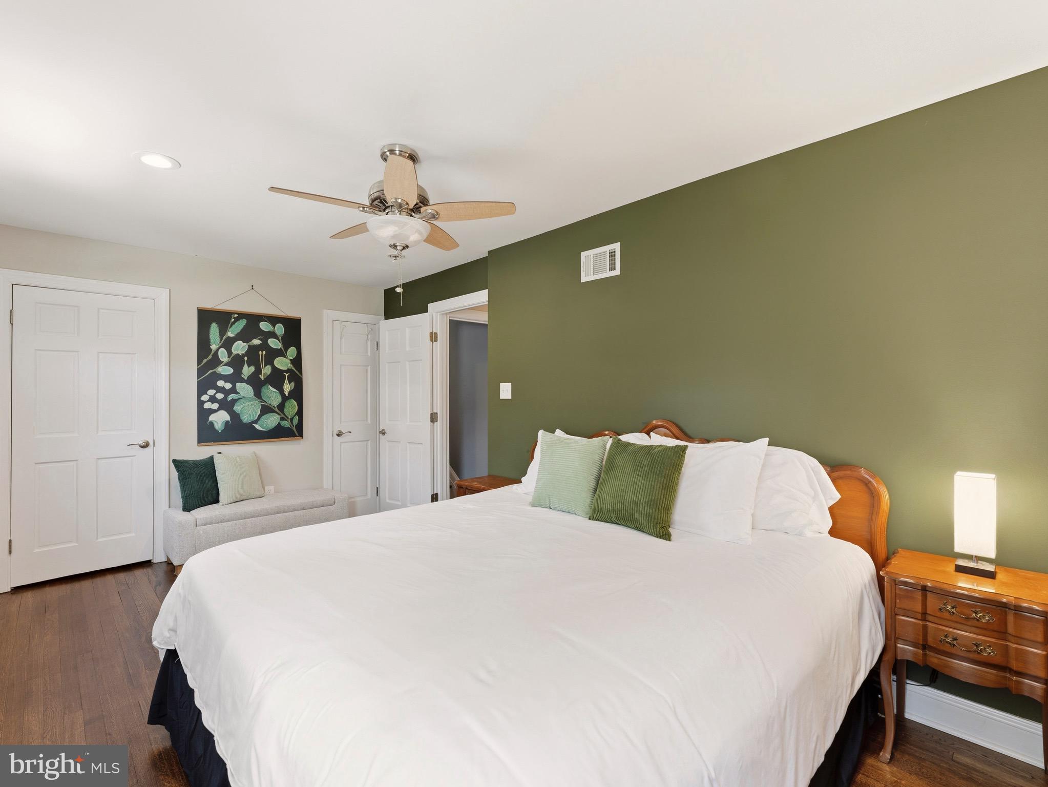 13744 Lockdale Road Silver Spring, MD 20906 - Photo 23 of 37 a bedroom with a large bed and a chandelier