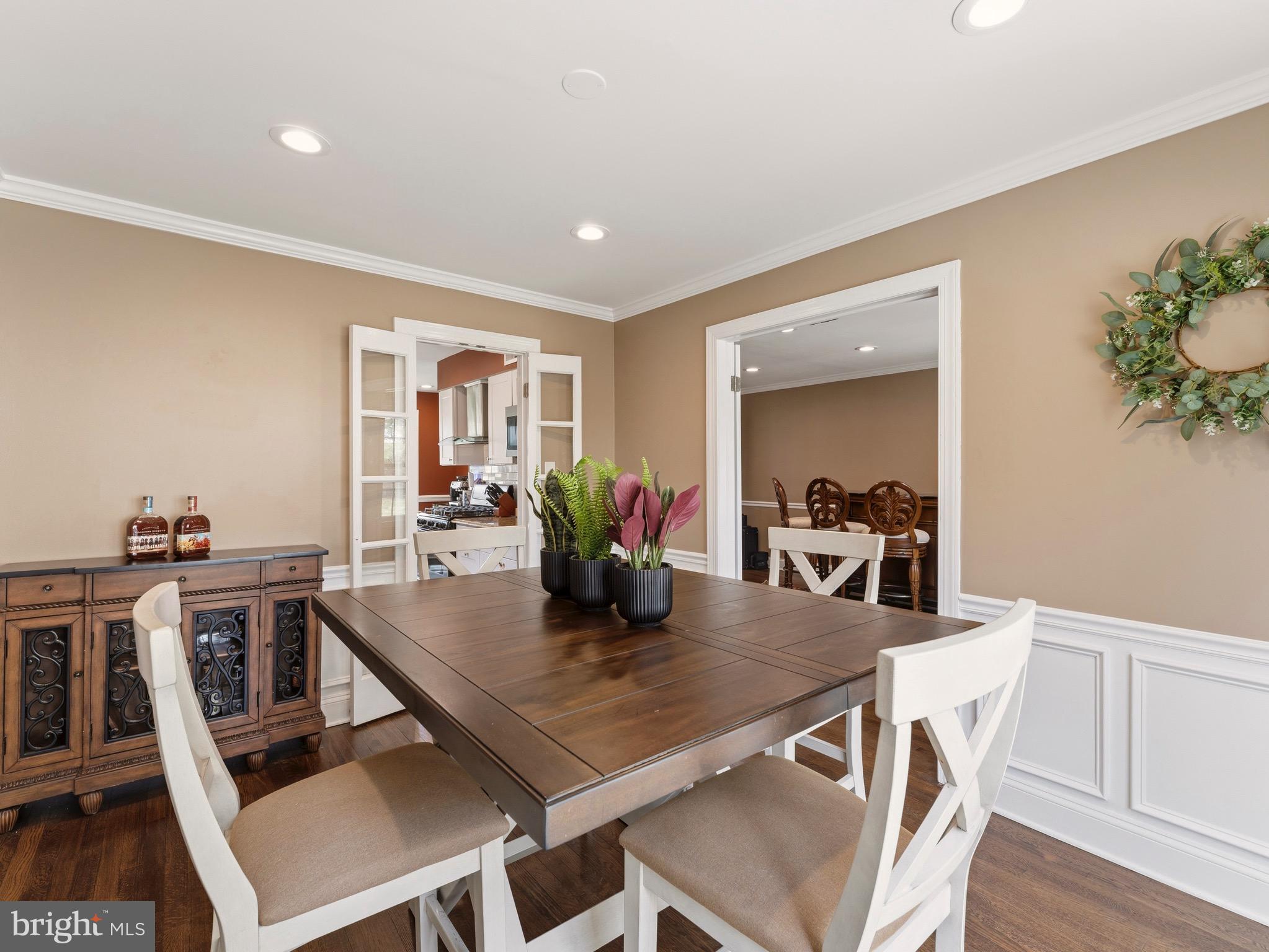13744 Lockdale Road Silver Spring, MD 20906 - Photo 10 of 37 a view of a dining room with furniture and a potted plant